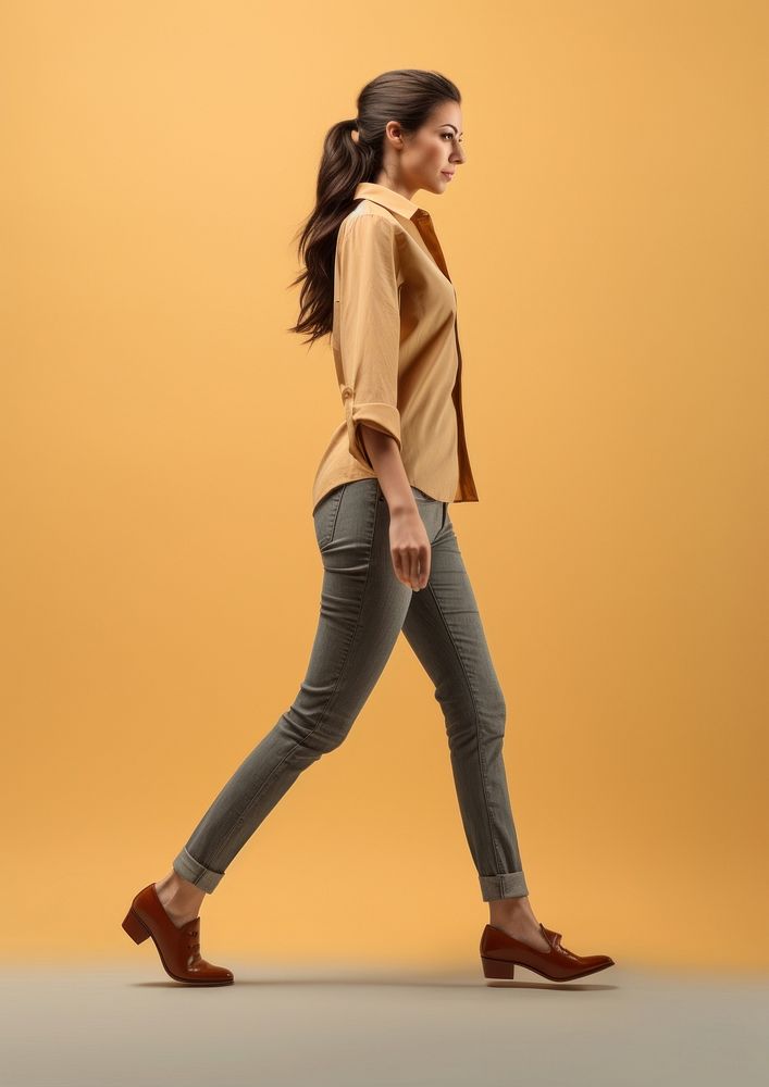 Photo of woman walking footwear jeans.