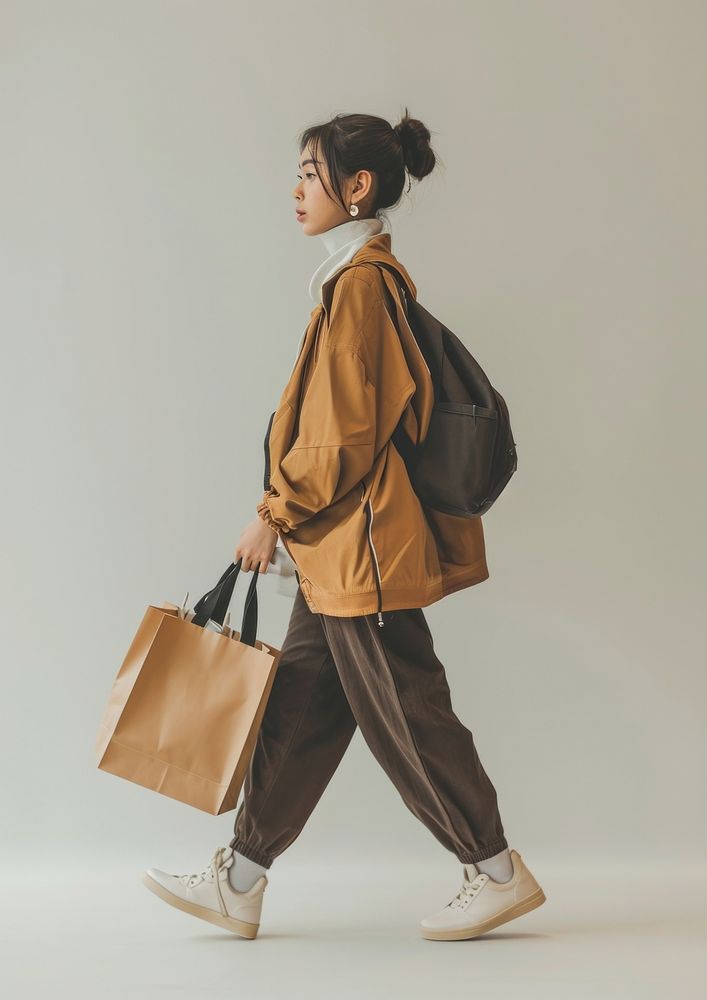 Photo of woman wearing casual outfit walking bag footwear.