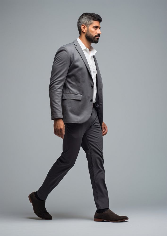 Photo of business man walking blazer tuxedo.