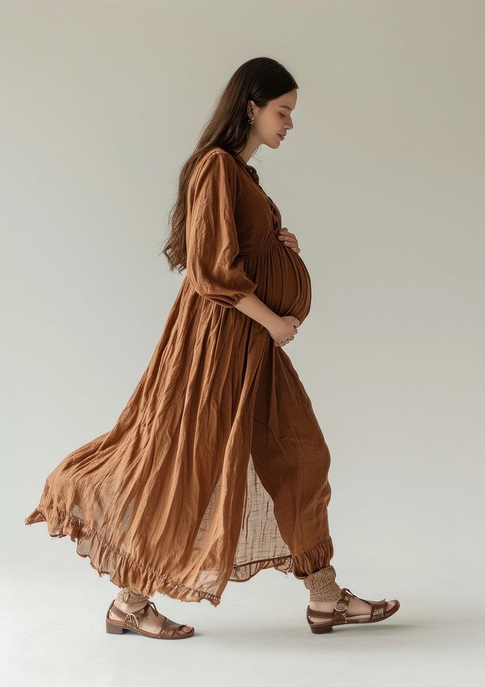 Photo of pregnant woman fashion sleeve dress.