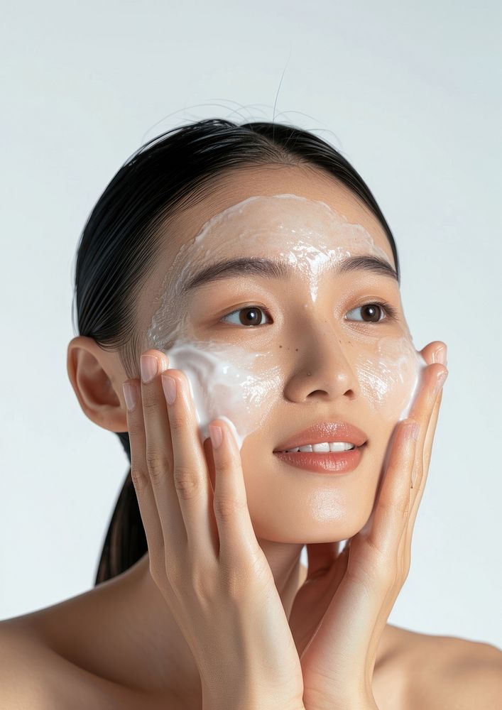 Woman cleansing her face portrait adult skin.