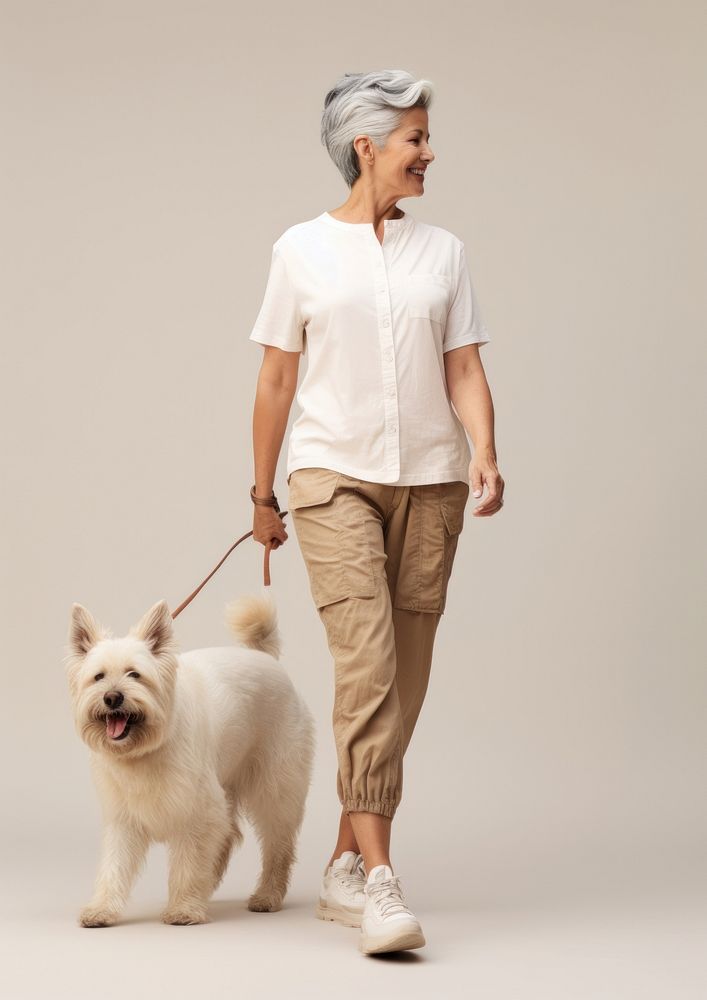 Cream shirt and pant  walking pet mammal.