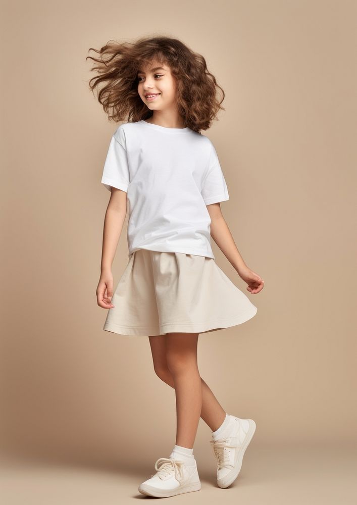 Cream t-shirt and skirt  person child human.