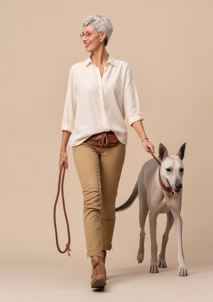 Cream shirt and pant  dog walking mammal.