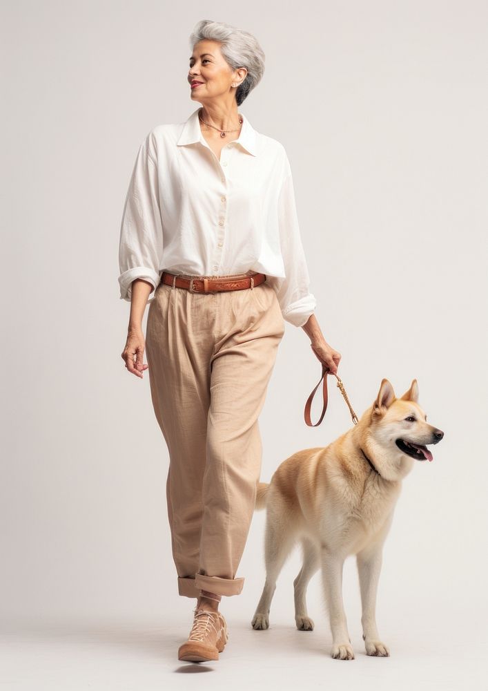 Cream shirt and pant  dog walking mammal.