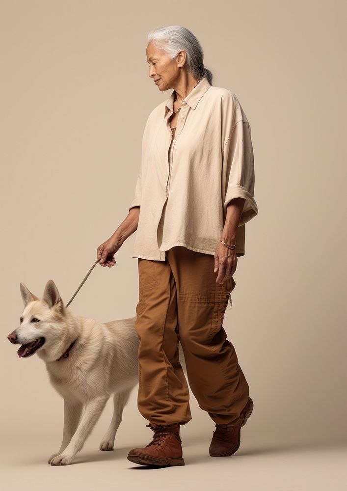 Cream shirt and pant  dog mammal animal.