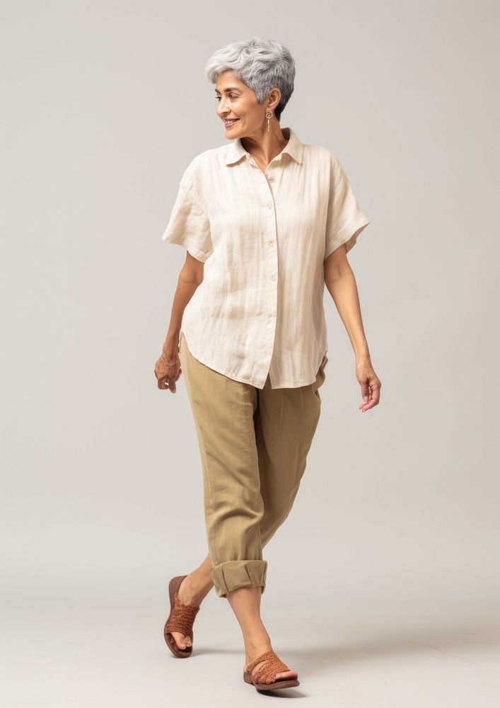 Cream shirt and pant  footwear person adult.