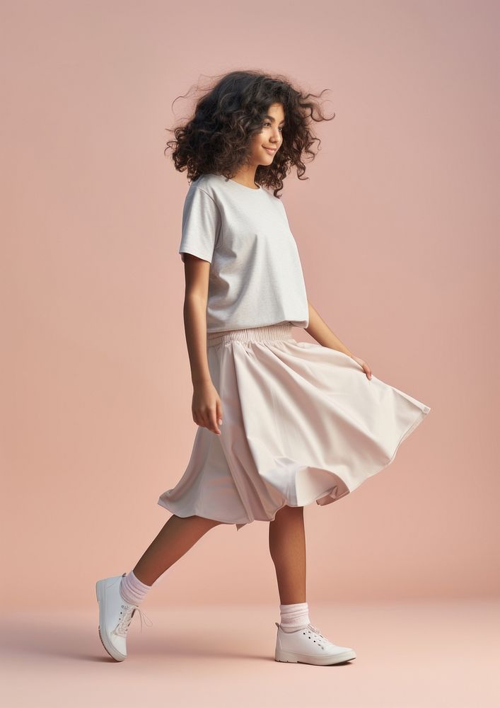 Cream t-shirt and skirt  footwear sleeve person.