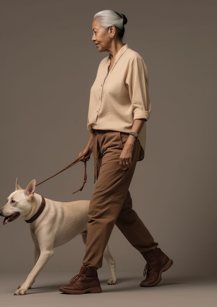 Cream shirt and pant  dog walking mammal.