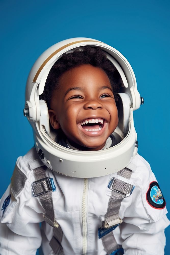 African boy wearing white astronaut suit happy baby blue.