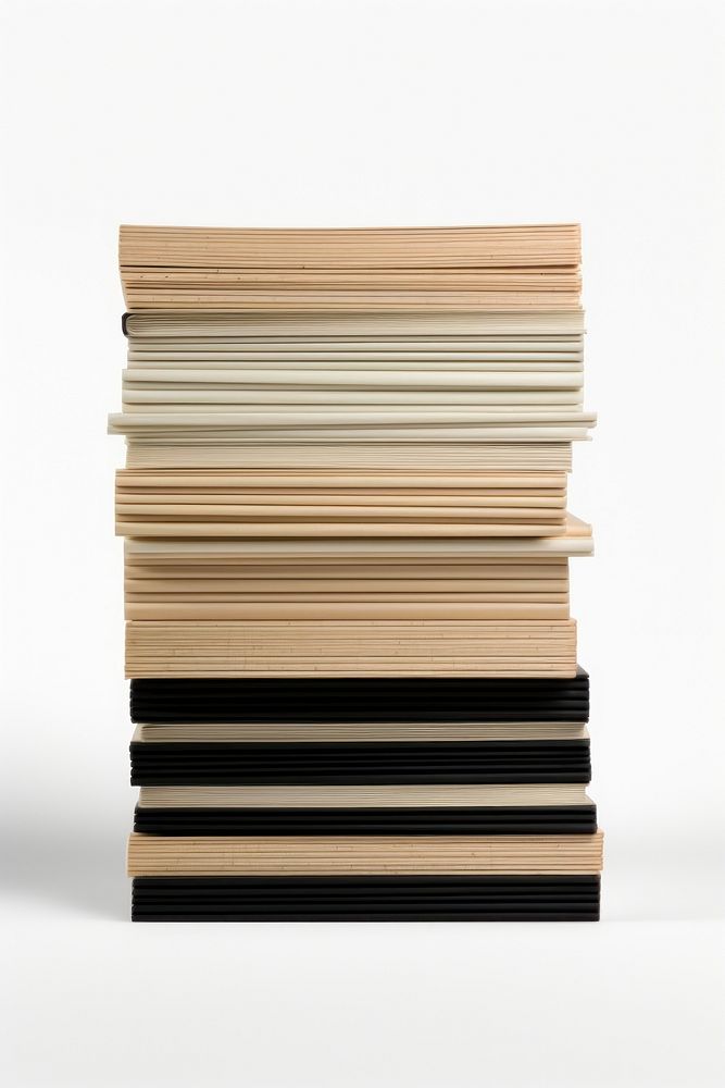 A stack of file folders publication plywood white background.