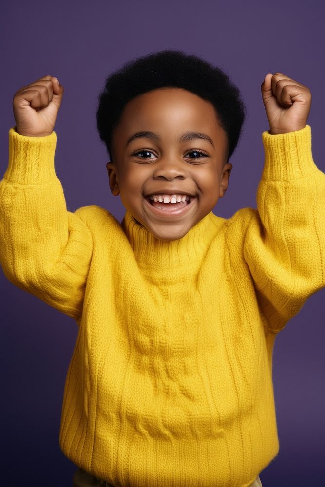 African boy with his hands up photography portrait sweater.