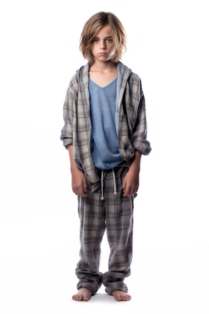 A boy in pajamas standing white background outerwear.
