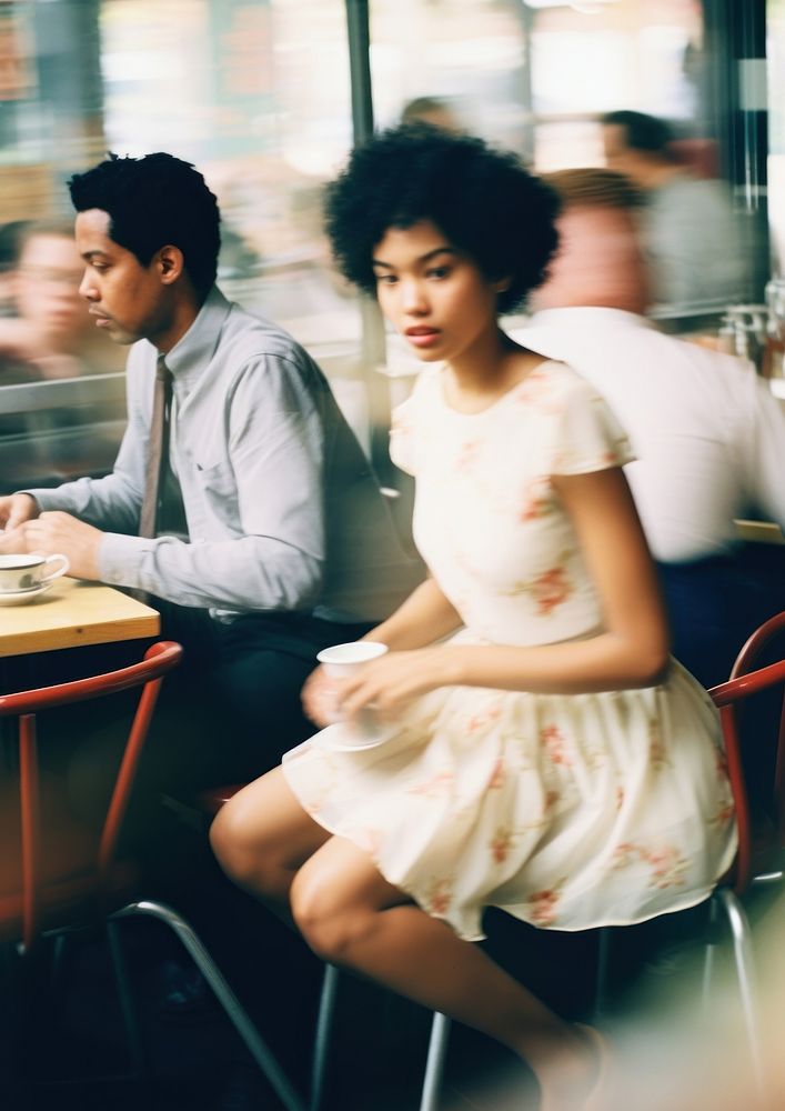 A motion blur black couple sitting in the cafe restaurant adult men.