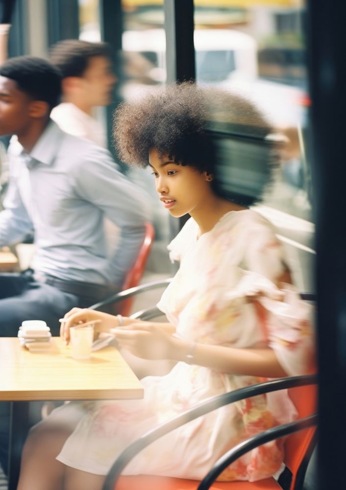 A motion blur black couple sitting in the cafe portrait adult architecture.