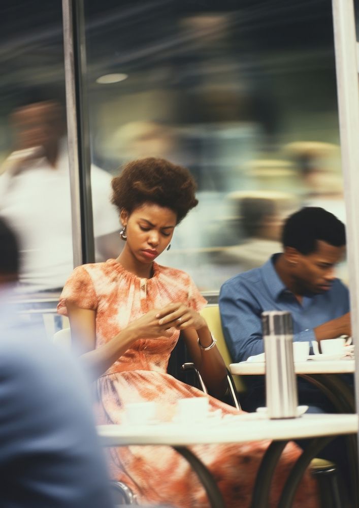 A motion blur black couple sitting in the cafe portrait photography adult.