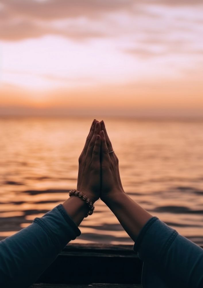 Hand doing meditation sitting on the sea adult spirituality tranquility. AI generated Image by rawpixel.