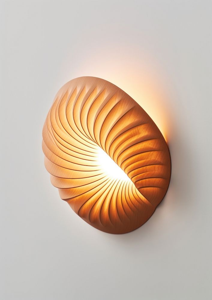 A wood shell wall light lamp illuminated lampshade.