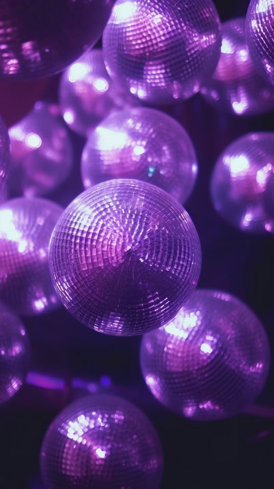  A purple disco balls light illuminated backgrounds. AI generated Image by rawpixel.