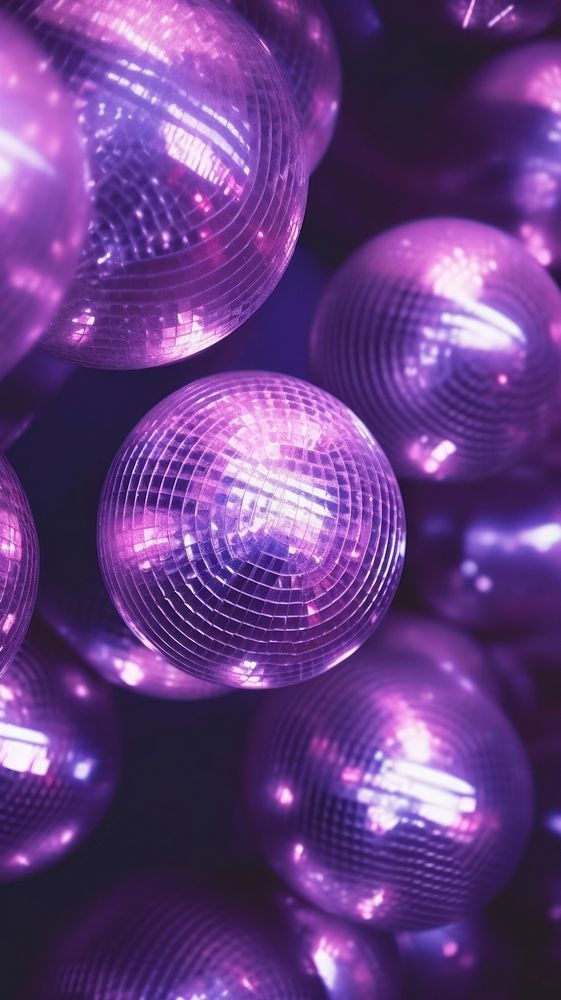  A purple disco balls illuminated backgrounds celebration. AI generated Image by rawpixel.