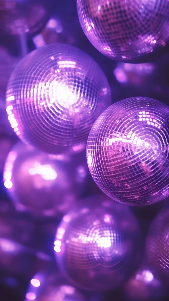  A purple disco balls lighting sphere illuminated. AI generated Image by rawpixel.