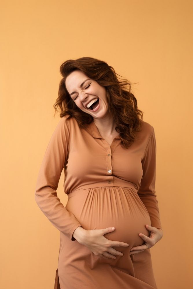 Happy Pregnant Woman laughing pregnant adult.