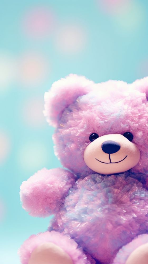 A teddy bear sits on cotton candy toy representation softness.