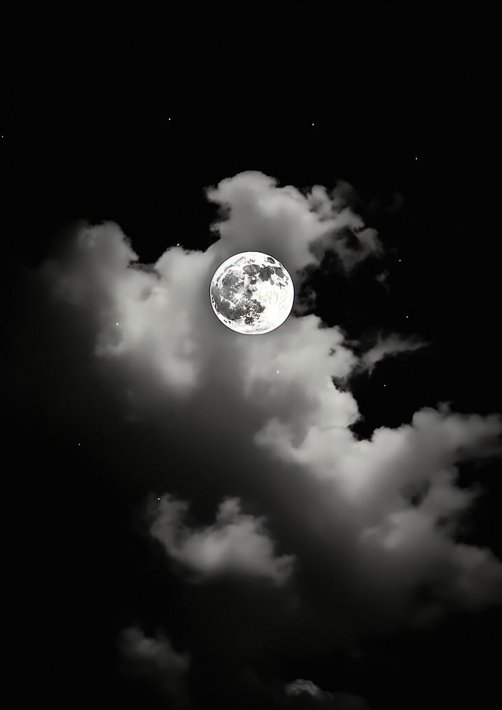 A full moon surrounding by the cloud astronomy outdoors nature.
