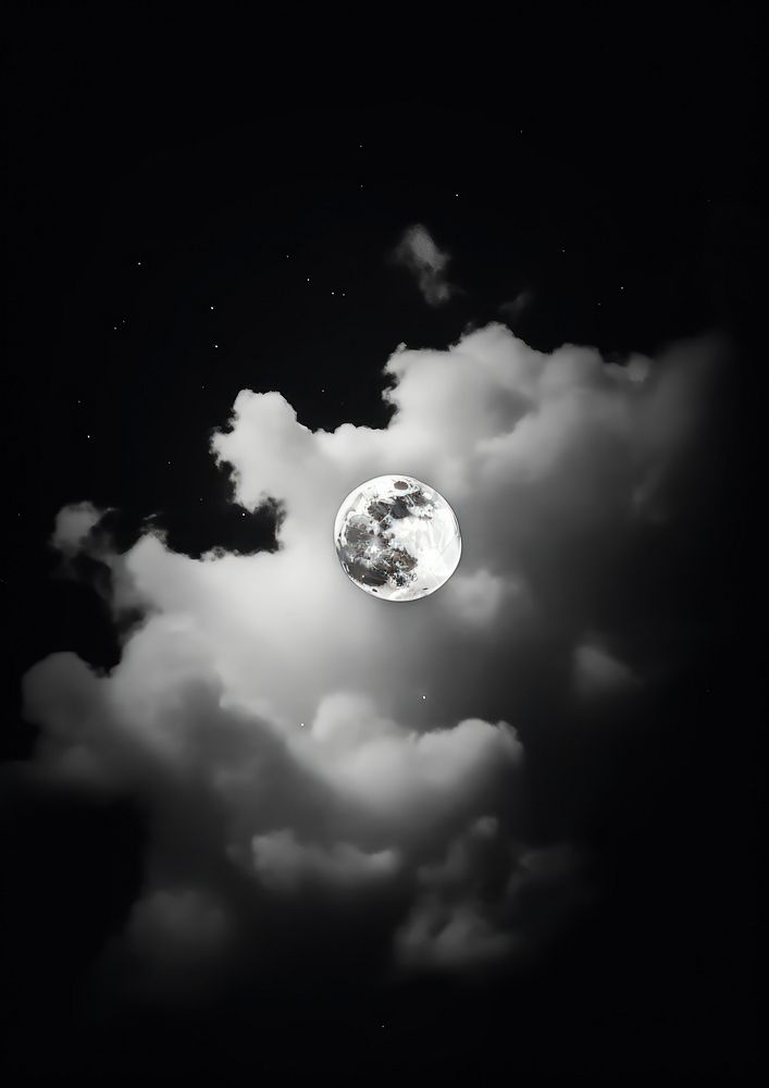 A full moon in the middle of the cloud astronomy outdoors nature.