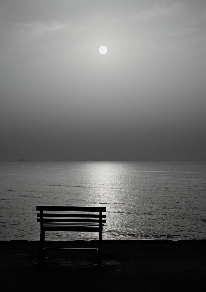 A full moon above the sea astronomy outdoors nature.