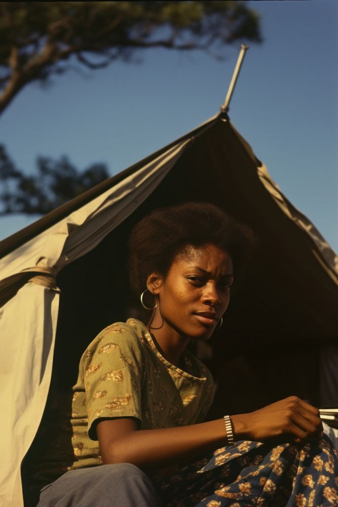 African woman travelling outdoors portrait camping.