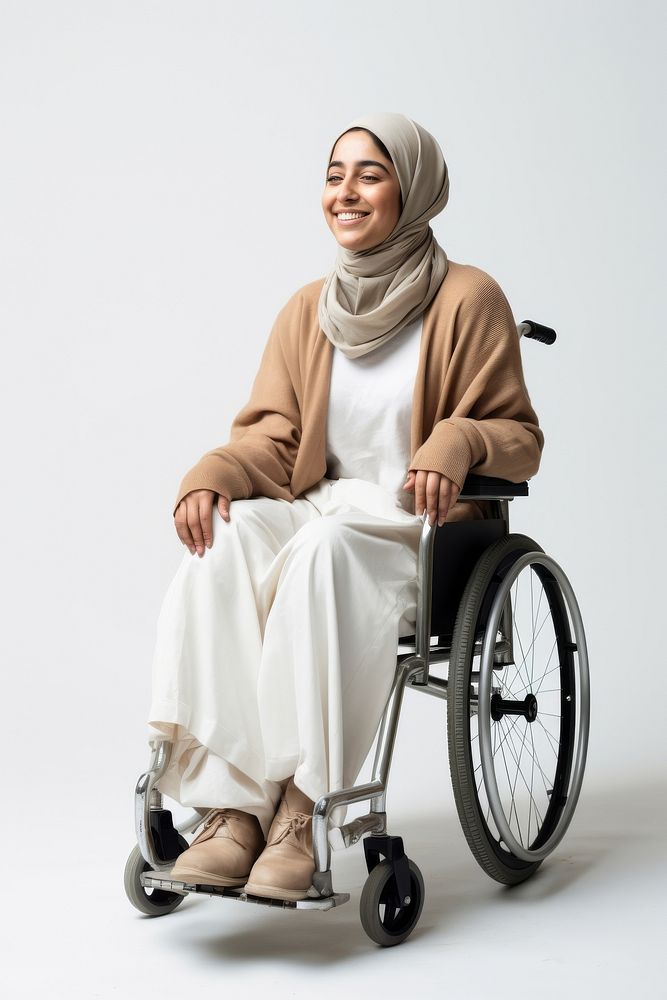 A disabled Iranian woman wheelchair sitting smiling.