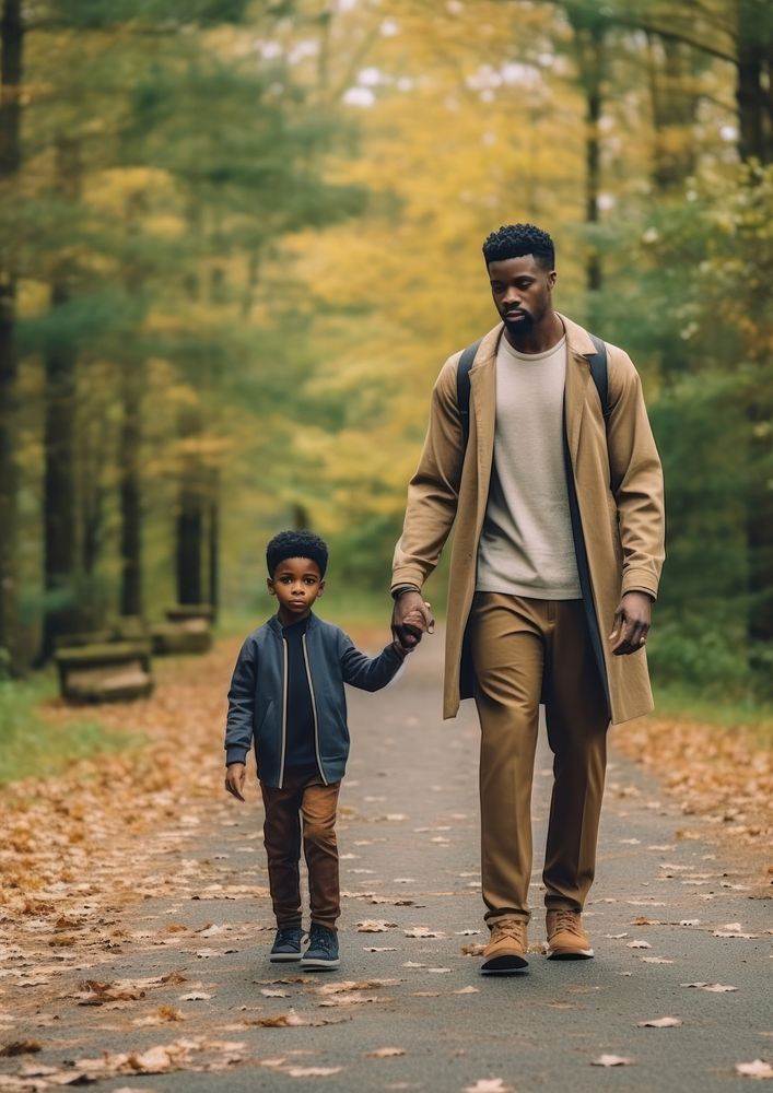 Black dad spend time with son walking family adult.