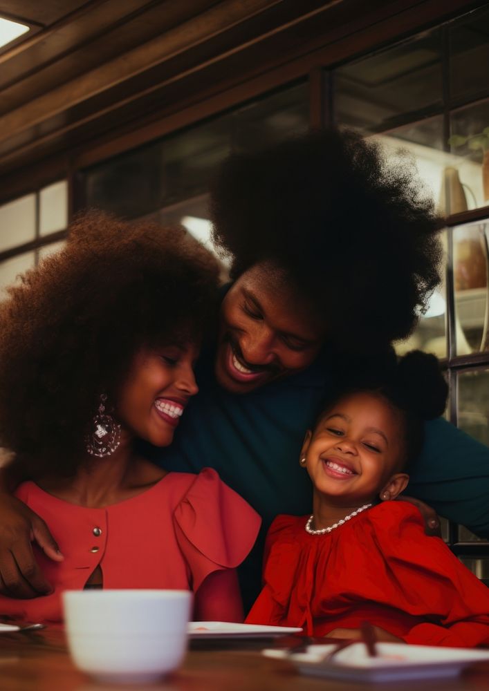 Black family spend time in the restaurant laughing portrait adult.