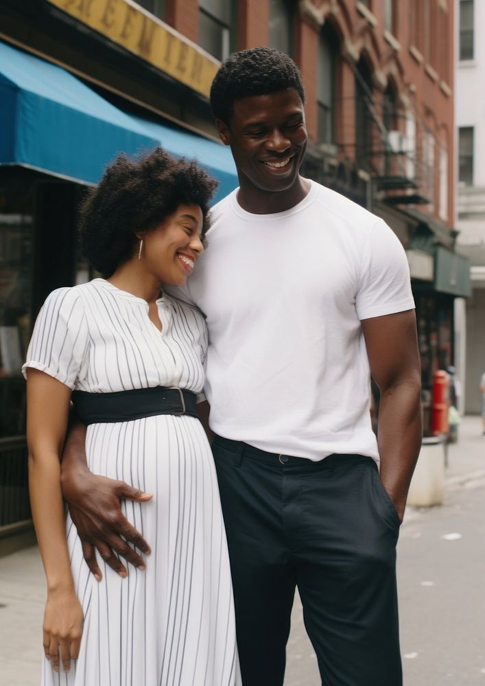 Black man holding hand pregnant woman portrait street adult.