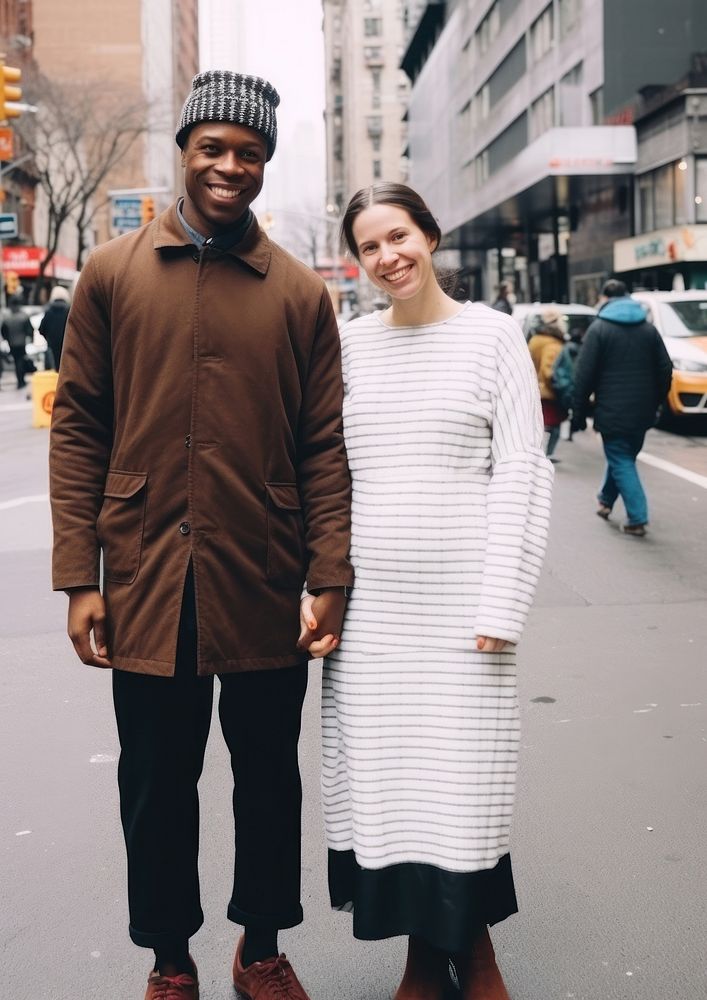 Black man holding hand pregnant woman standing street adult.