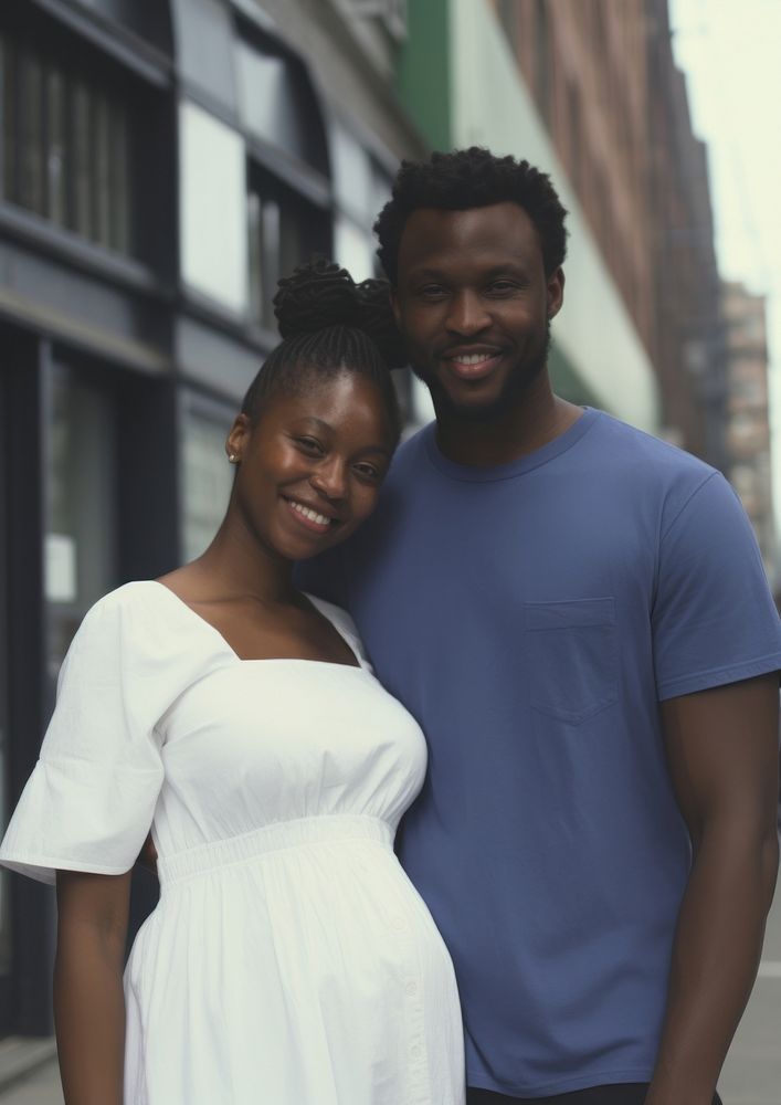 Black man holding hand pregnant black woman portrait street adult.