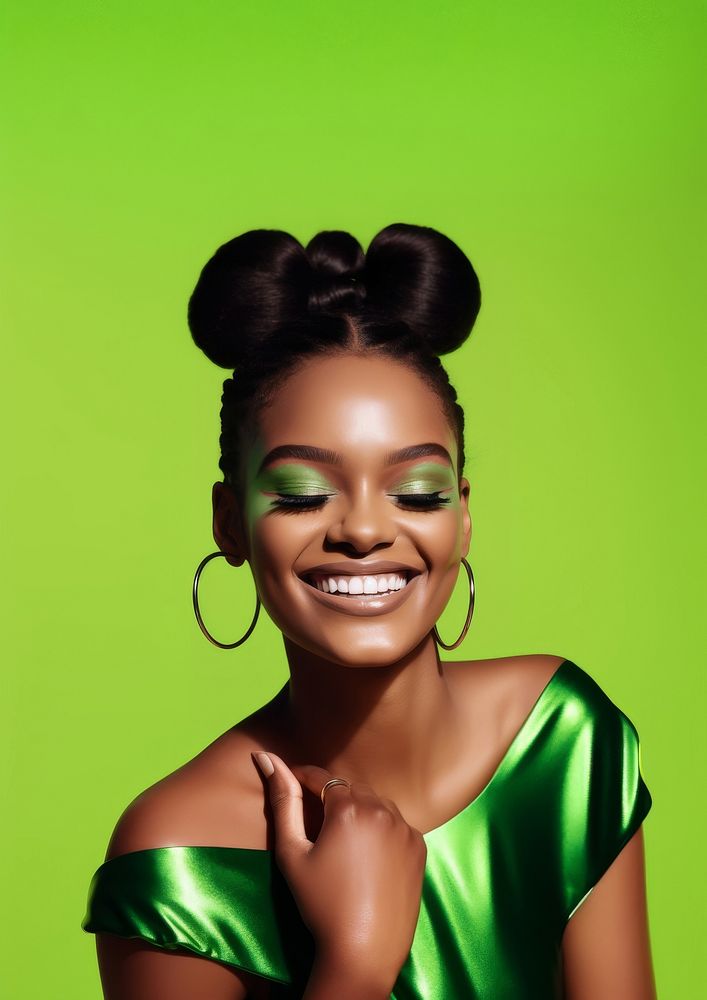 A black woman smile with green cat eye shadow makeup photography portrait jewelry.