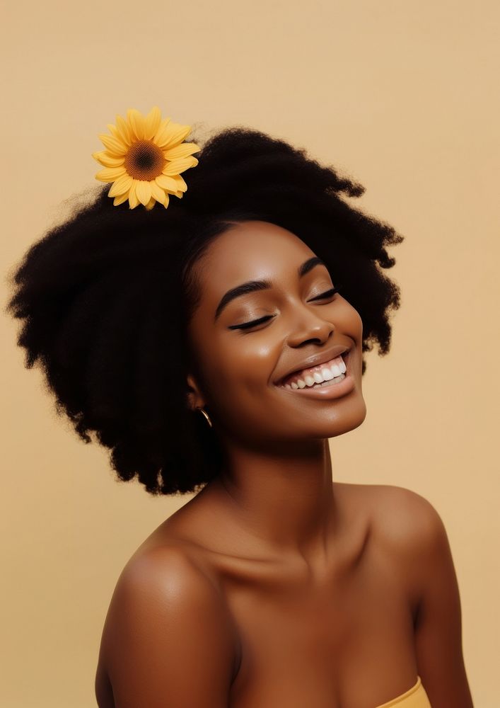 A black woman smile with several sunflower hair clip photography portrait fashion.