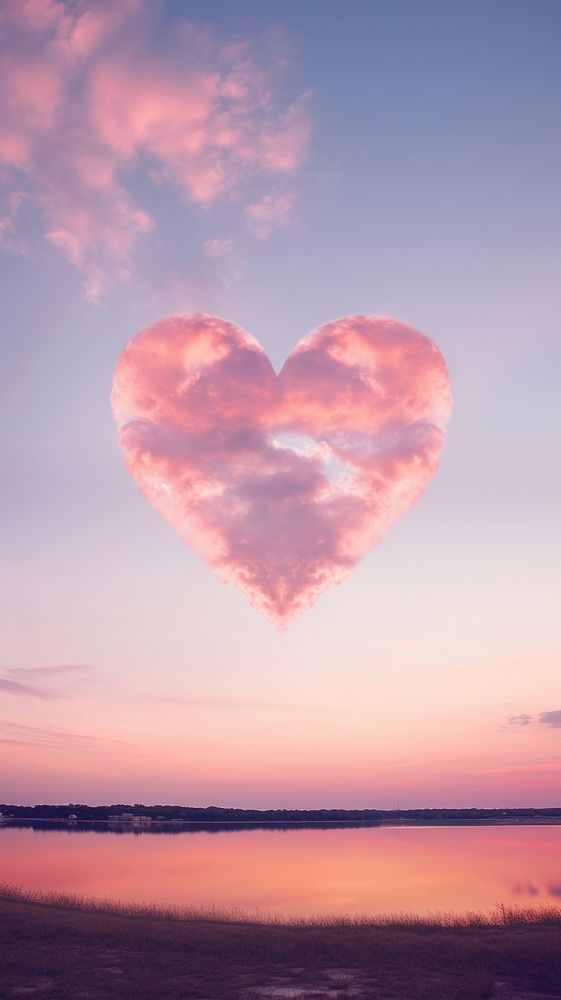  Heart shaped on sky outdoors sunset nature. 