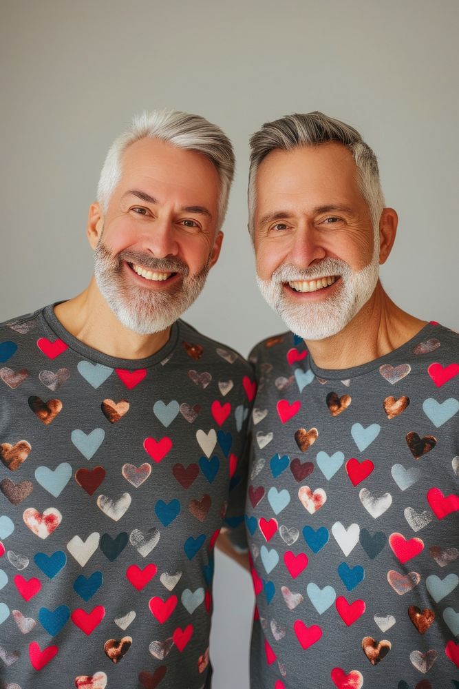 Couple gay man wearing heart-shaped matching shirts portrait t-shirt smiling.