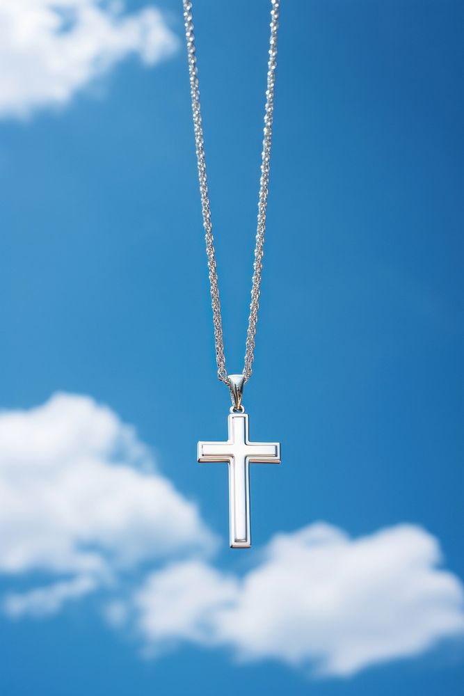 A sterling silver cross necklace pendant jewelry symbol.