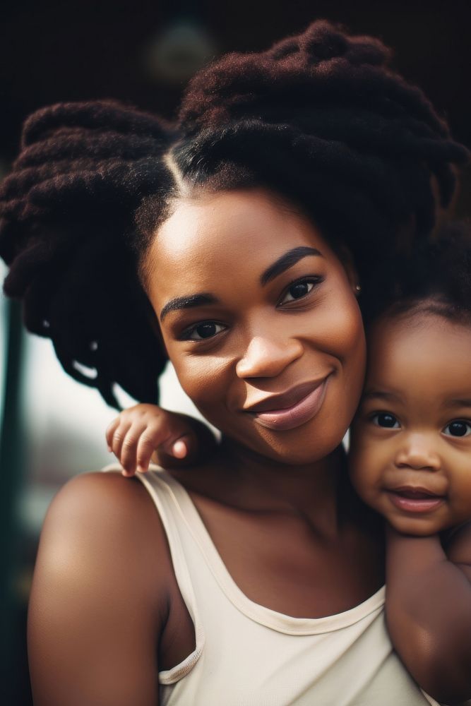 Black mom holding a tiny child photography portrait family.