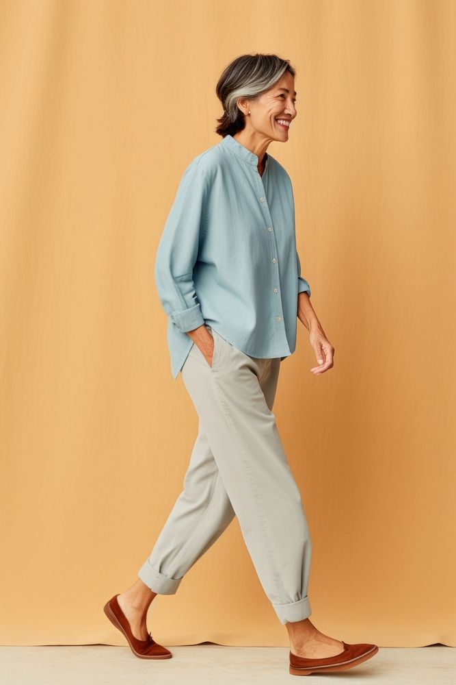 A senior woman walking sleeve blouse.