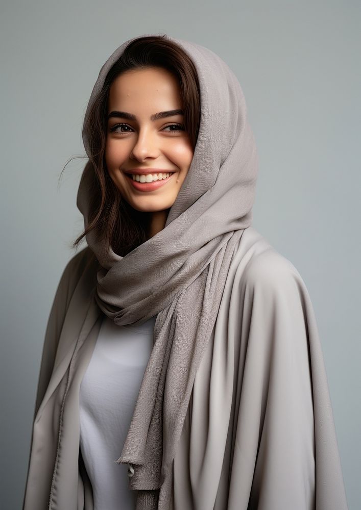 Middle eastern teen woman in abaya and hijab portrait smiling scarf.