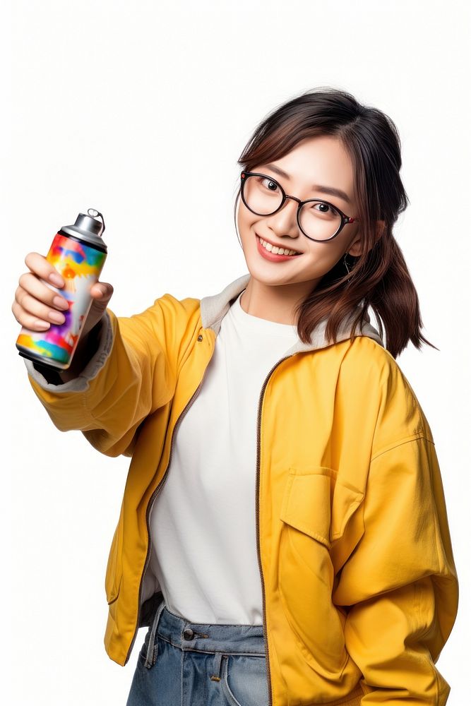 A young woman holding a colour spray bottle and pointing to camera portrait smile photo. AI generated Image by rawpixel.