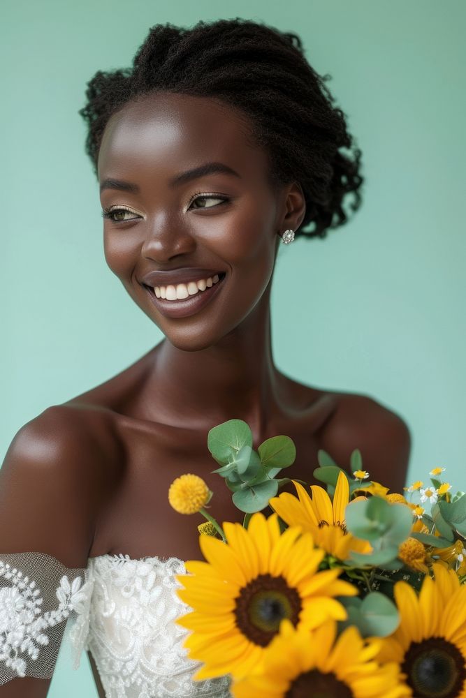 African woman in wedding dress holds a bouquet of sunflowers portrait smiling adult.