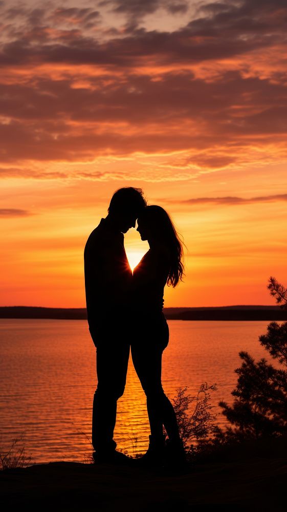  Silhouette of a couple sharing a gentle embrace backlighting outdoors horizon. AI generated Image by rawpixel.