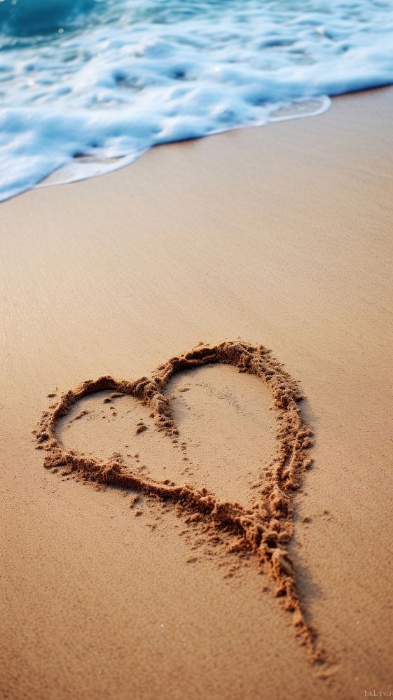  The word love written in sand on the beach tranquility footprint sunlight. AI generated Image by rawpixel.