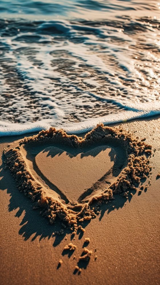  Beach heart sand tranquility. AI generated Image by rawpixel.